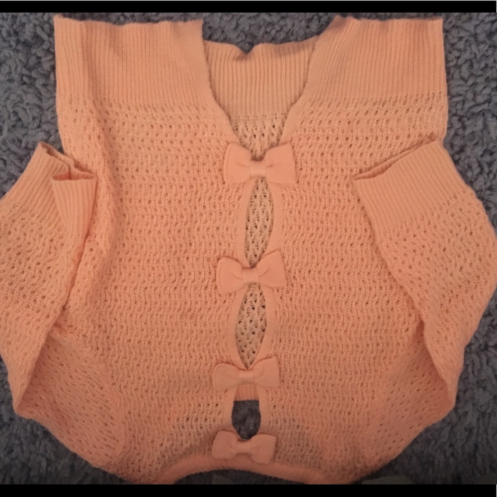 Open back bow pink sweater